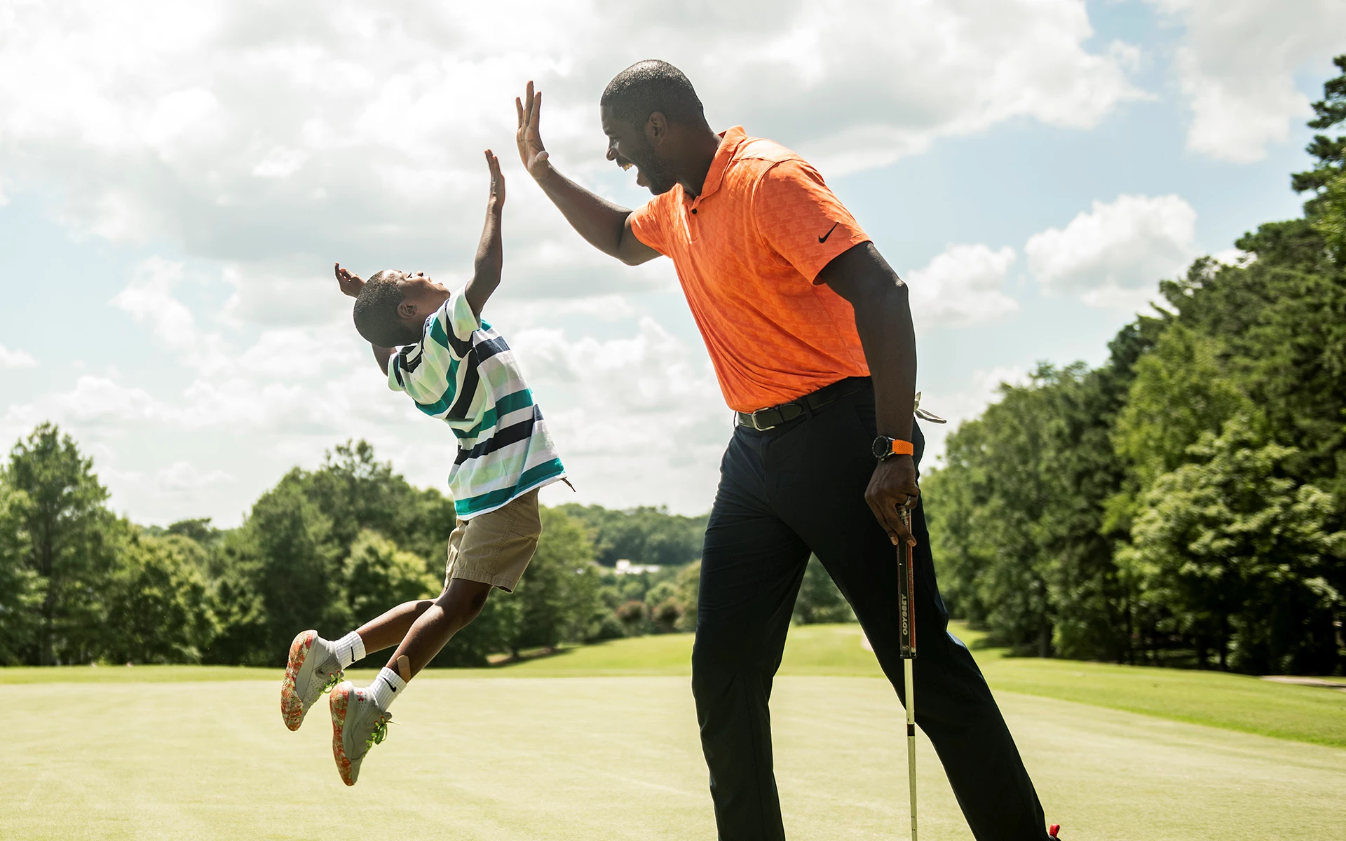 father and son golfing at Ardea