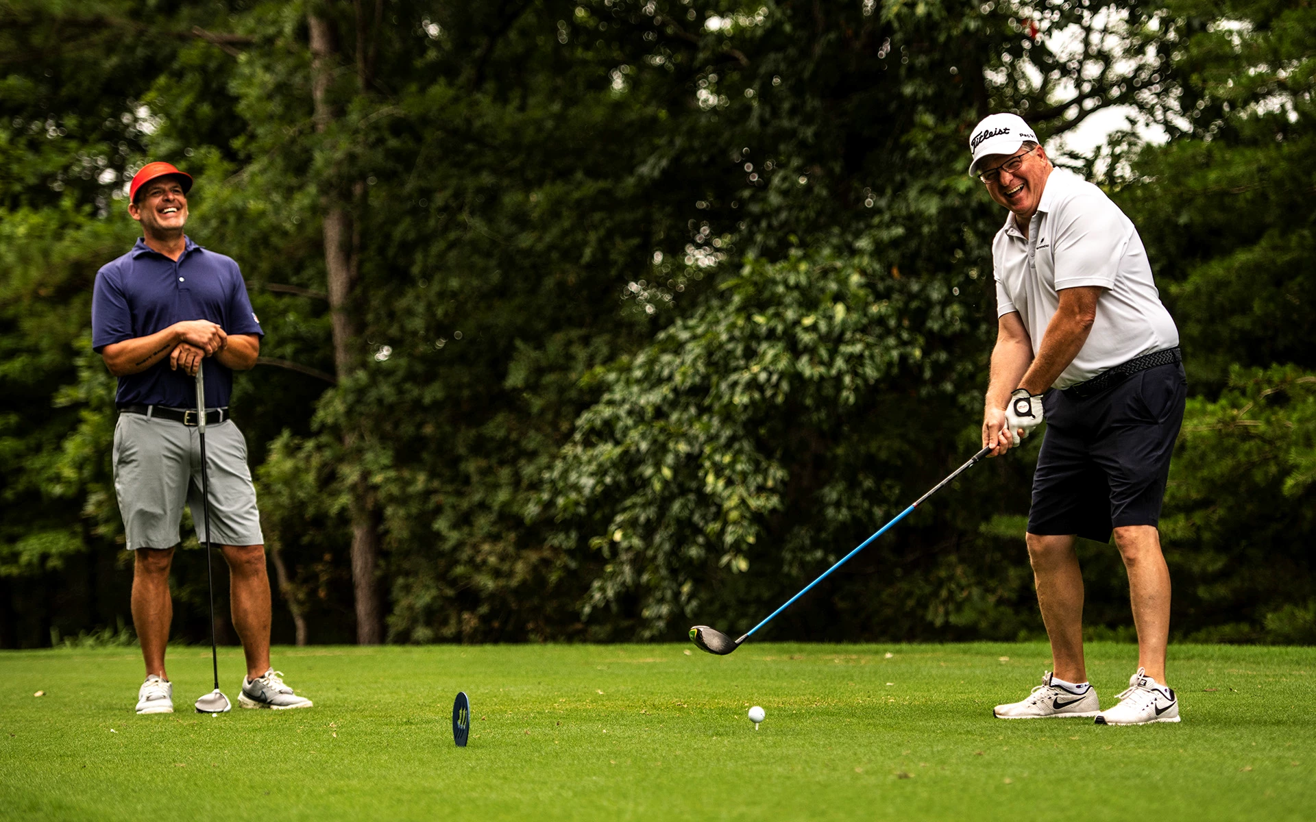 Ardea members laughing while playing a round of golf